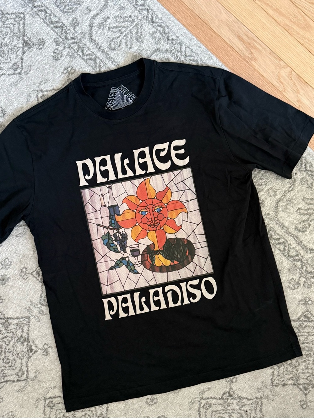 Like new PALACE paladiso Black Tee with Colorful Stained-Glass Sun Graphic